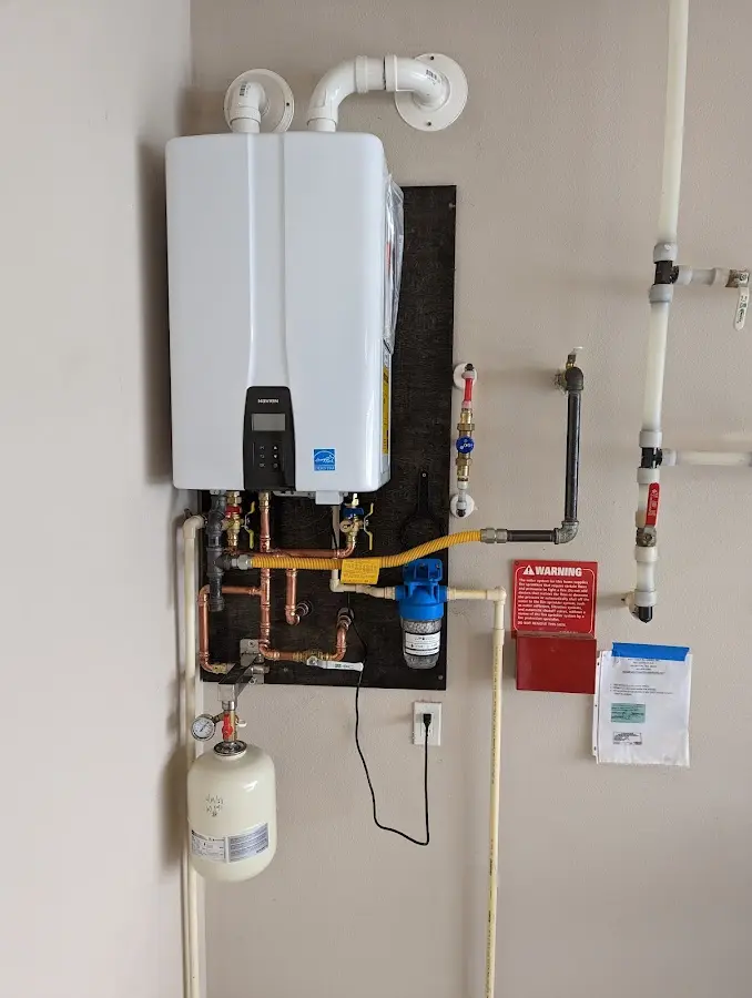 Professional plumber installing copper piping in a Horseheads home